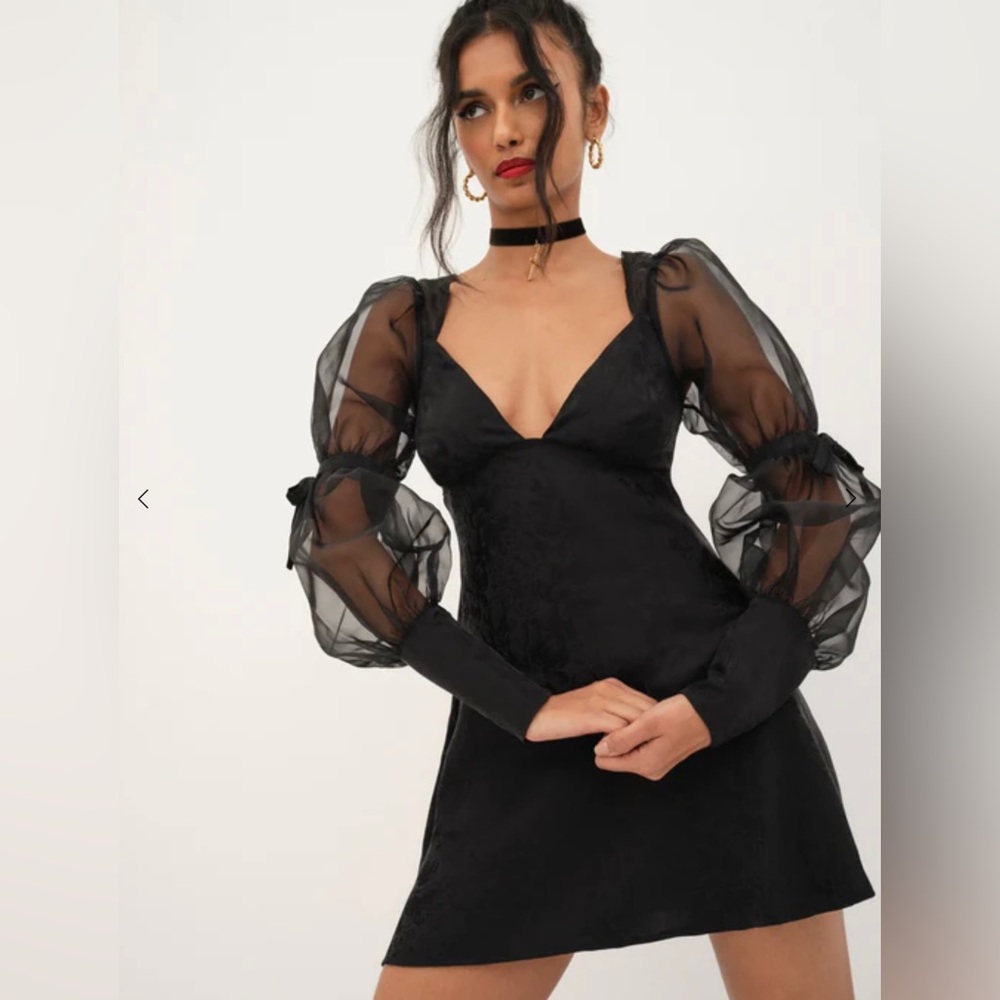 For love and lemons black dress. V neck dress. Puffy sleeves